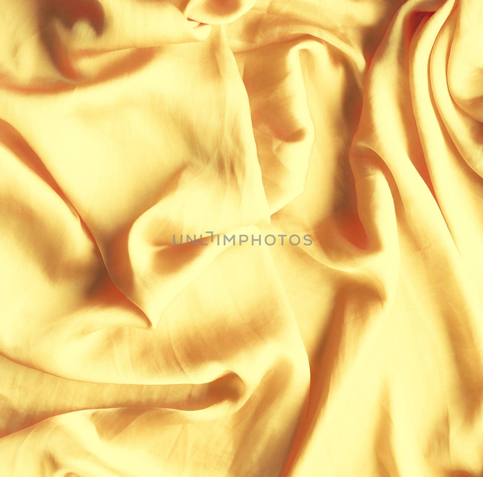 Luxury golden silk - elegant fabric textures, abstract backgrounds and modern pastel colours concept