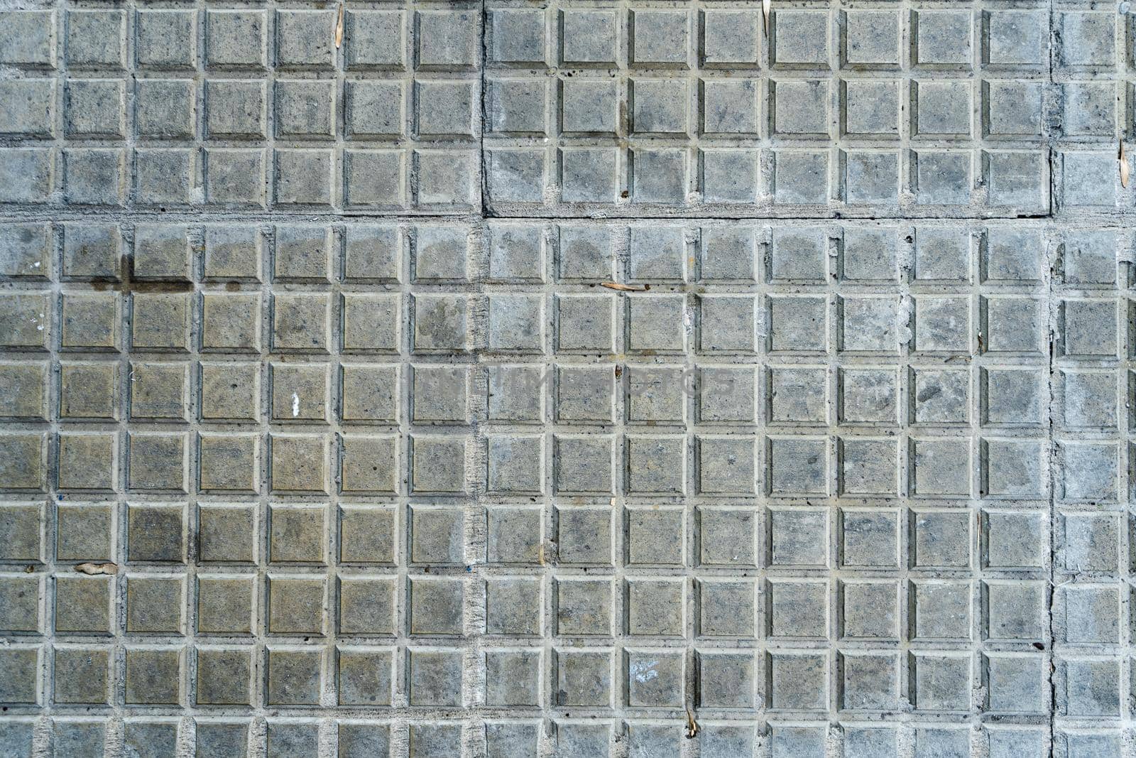 Background of square tiles or slabs on a wall. by hdcaputo