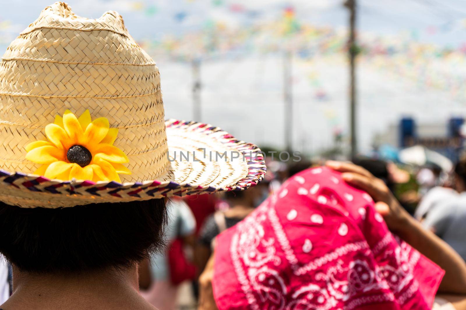 Man with a hat with a sunflower in the traditional festivities of Santo Domingo Managua Nicaragua
