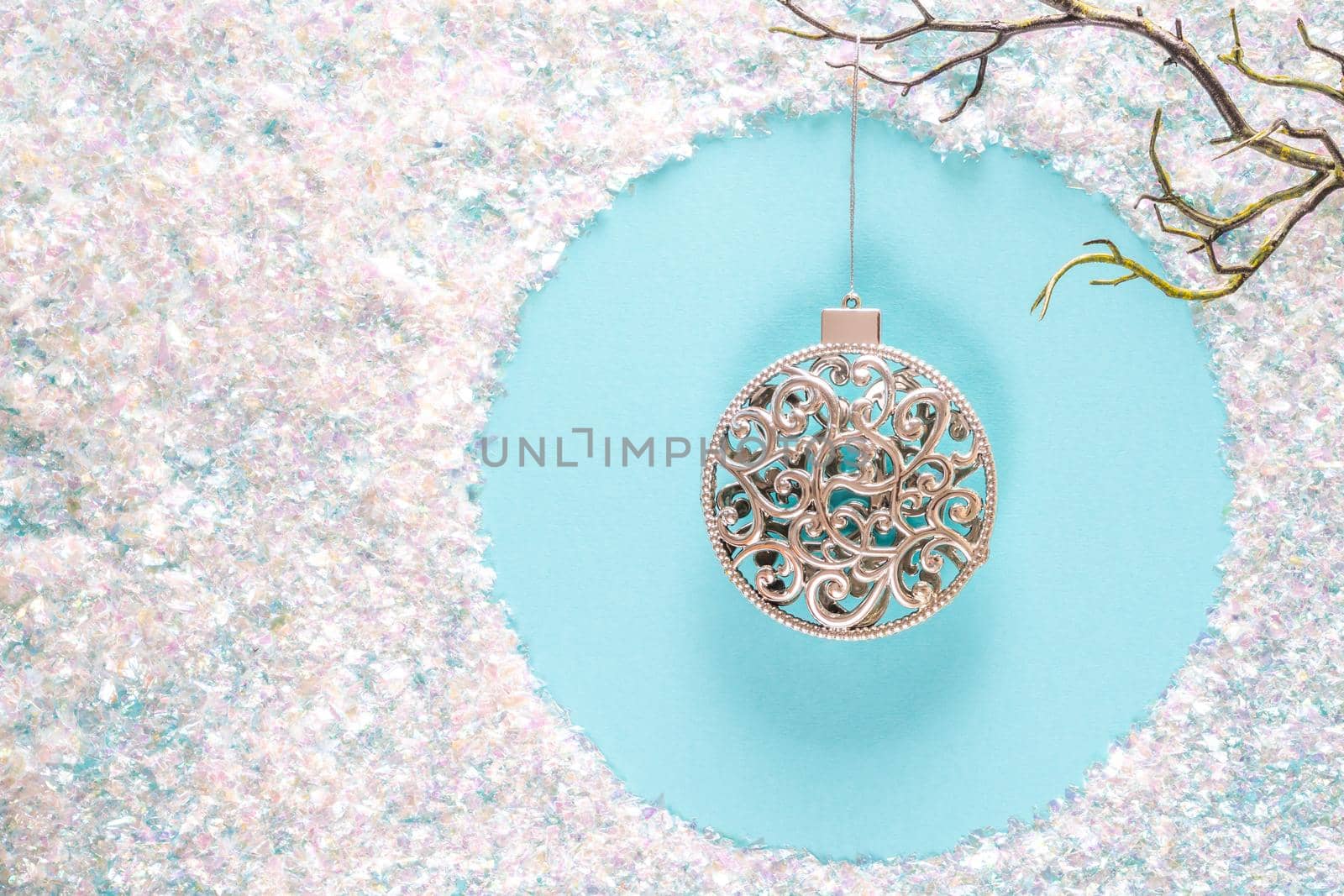 Modern Christmas holiday ornament decorations in contemporary trendy blue and white colors with sparkling glitter on blue background. Flat lay with copy space by Mariakray