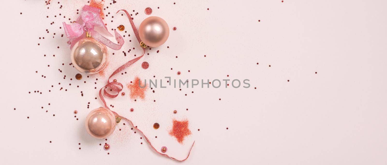 Postcard with Christmas balls, pink and golden decorations on white background. top view, copy space by Mariakray
