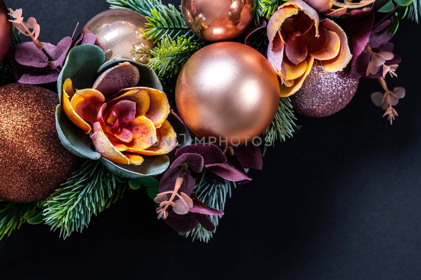 Beautiful unusual Christmas wreath decoration on black background. flat lay by Mariakray