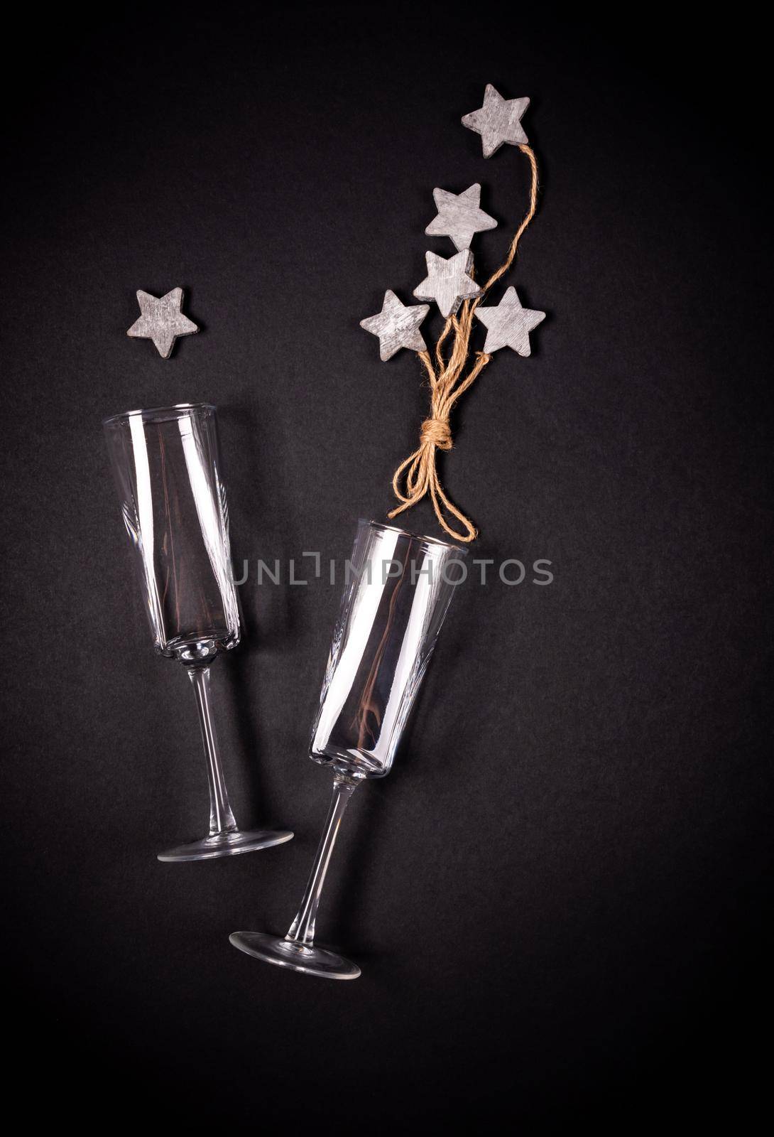 Two glasses with wooden tar decoraion with rope, flat lay, celebration concept by Mariakray