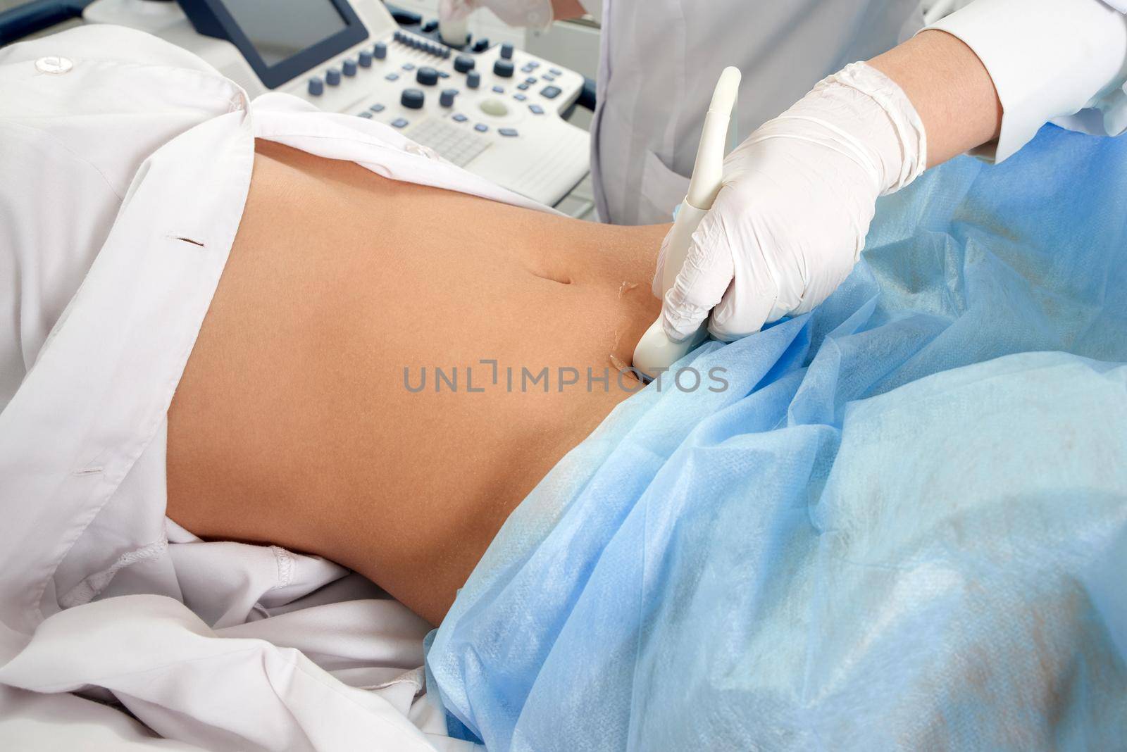 Cropped view of woman at gynecologist's doing ultrasound scan by Mariakray