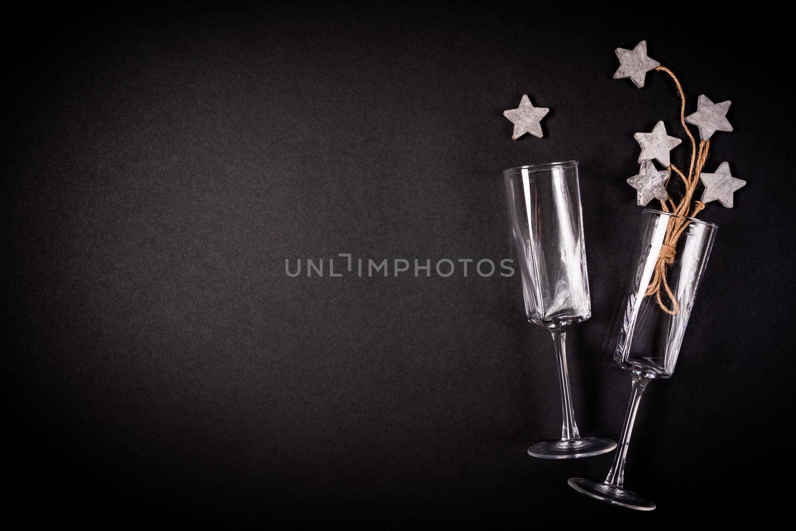 Two glasses with wooden tar decoraion with rope, flat lay, celebration concept by Mariakray
