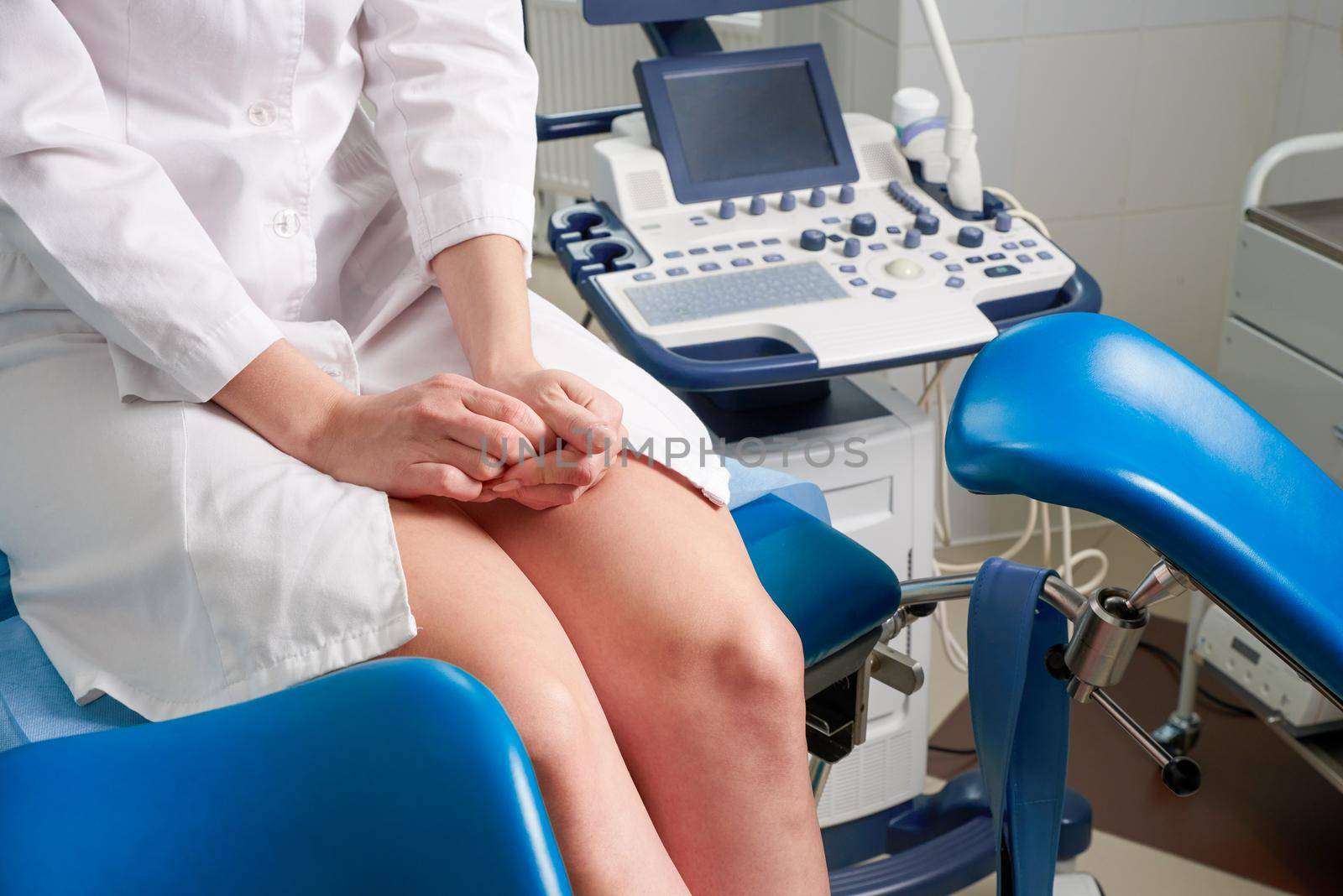 Woman at gynecologist office sitting and waiting for a doctor with test result