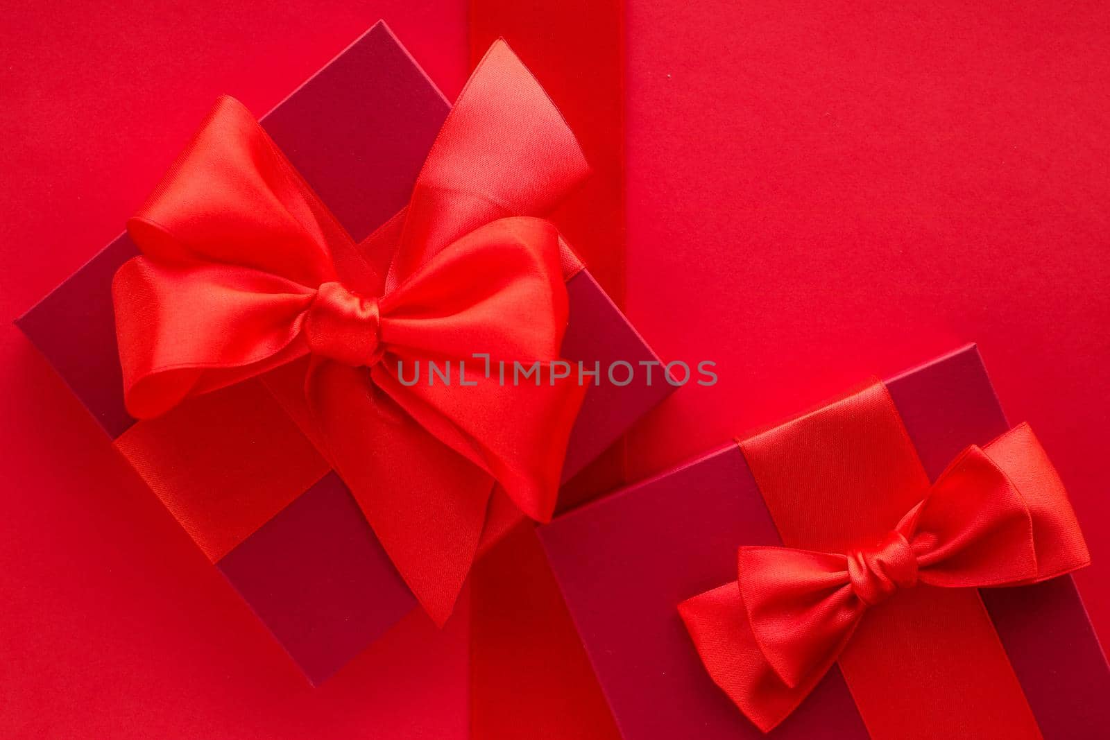Luxury holiday gifts on red by Anneleven