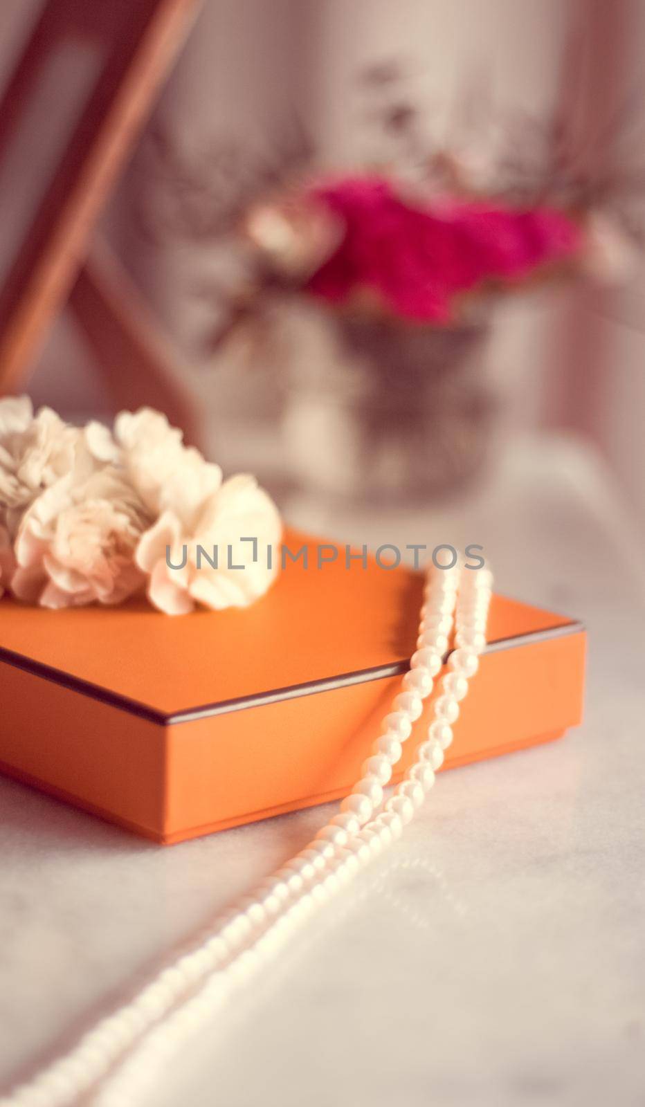 Present box and flowers for her - Mother's day ideas, happy giving and holiday inspiration concept. The perfect gift for mom