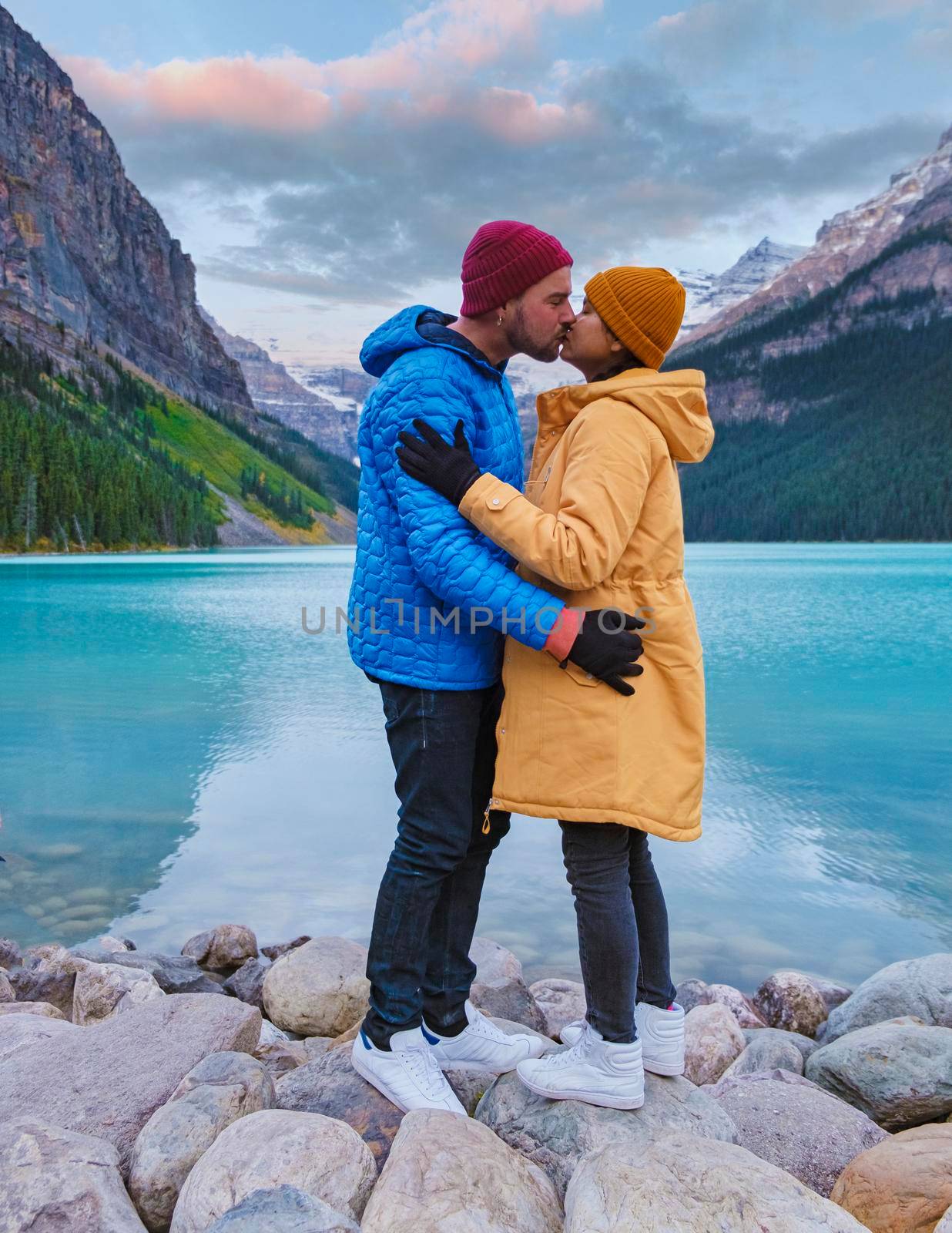 Lake Louise Canadian Rockies Banff national park, of iconic Lake Louise in Banff National Park in the Rocky Mountains of Alberta Canada. Romantic lovely couple men and women by the lake