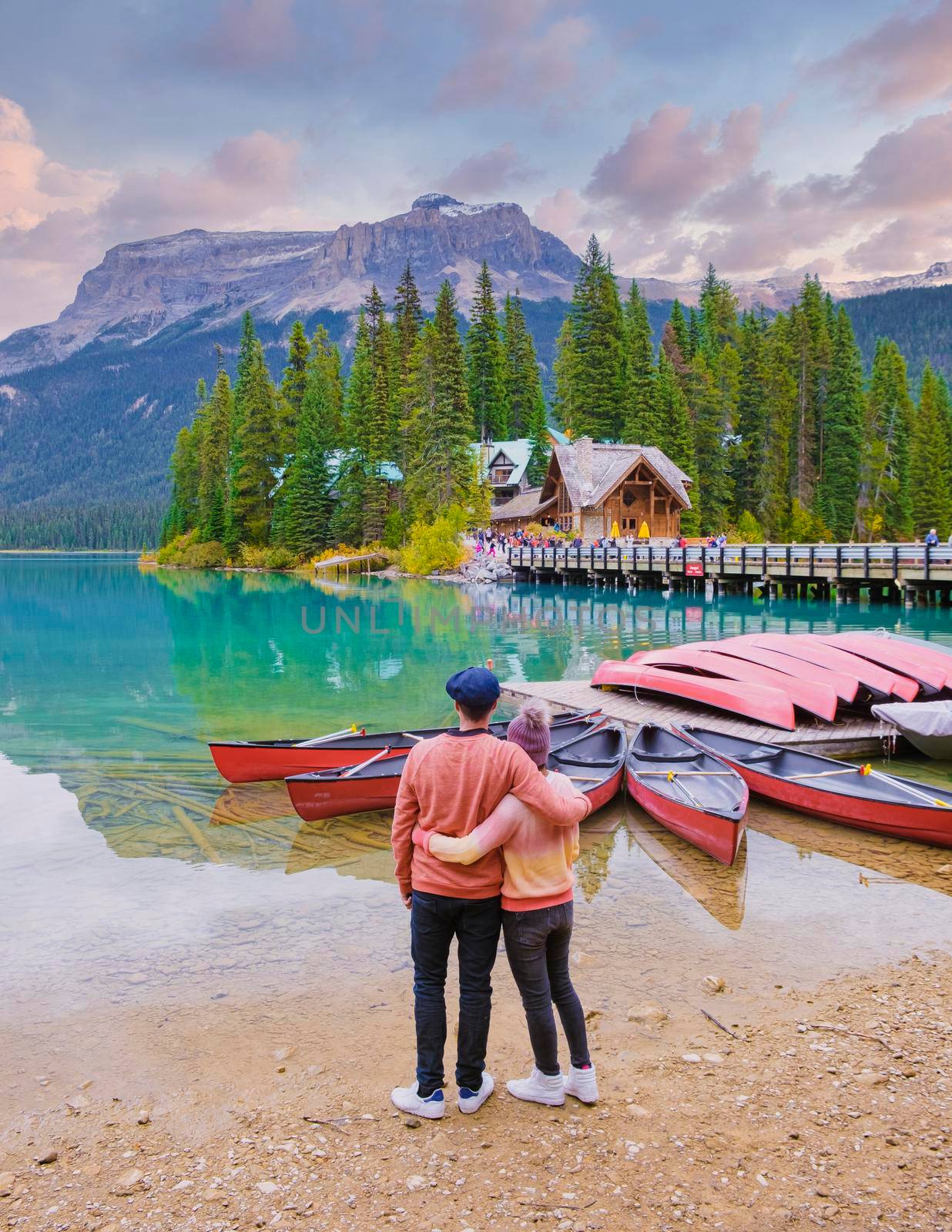 Emerald lake Yoho national park Canada British Colombia. beautiful lake in the Canadian Rockies during the Autumn fall season. Couple of men and women standing by the lake