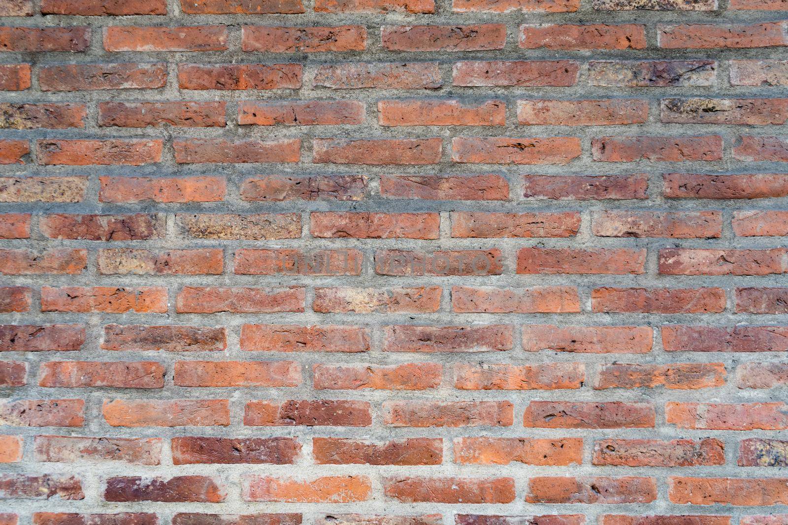 A Background of rectangular bricks on a wall.