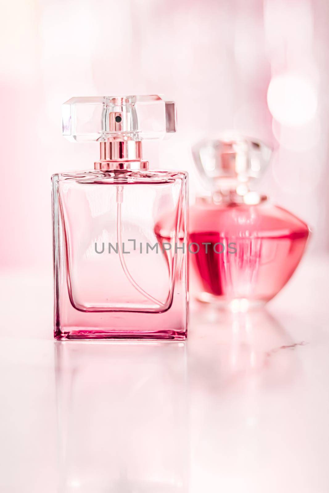 Perfume bottles on glamour background, floral feminine scent, fragrance and eau de parfum as luxury holiday gift, cosmetic and beauty brand present concept