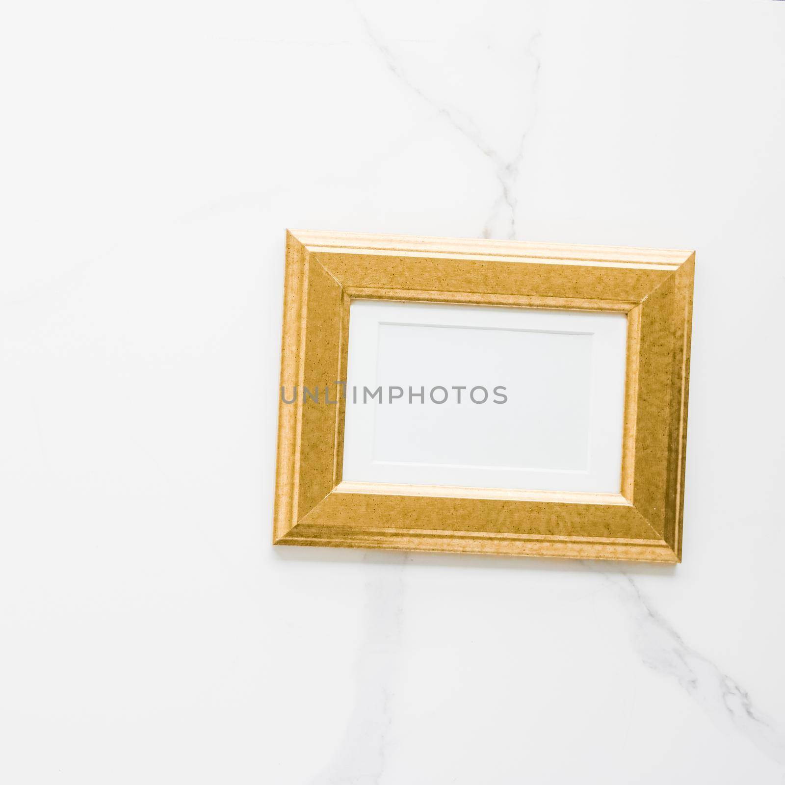 Golden photo frame on marble, flatlay - modern feminine, artwork mock up, luxury design concept. Decorate with chic and style