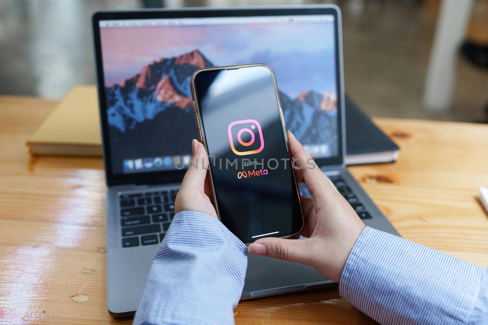 CHIANG MAI, THAILAND - AUG 23, 2022 : A woman hand holding iphone with search page screen of instagram application. Instagram is largest and most popular photograph social networking.