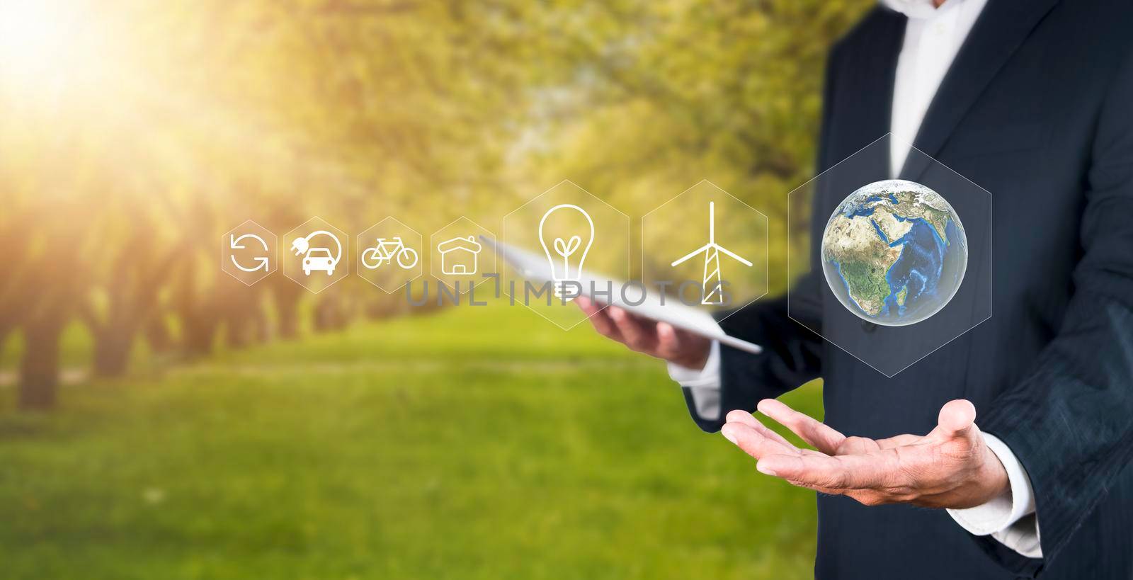 Environment concept Business man hold and show global with eco icon. business man using tablet to analyze environmental conservation industry Environmental protection business for a sustainable future