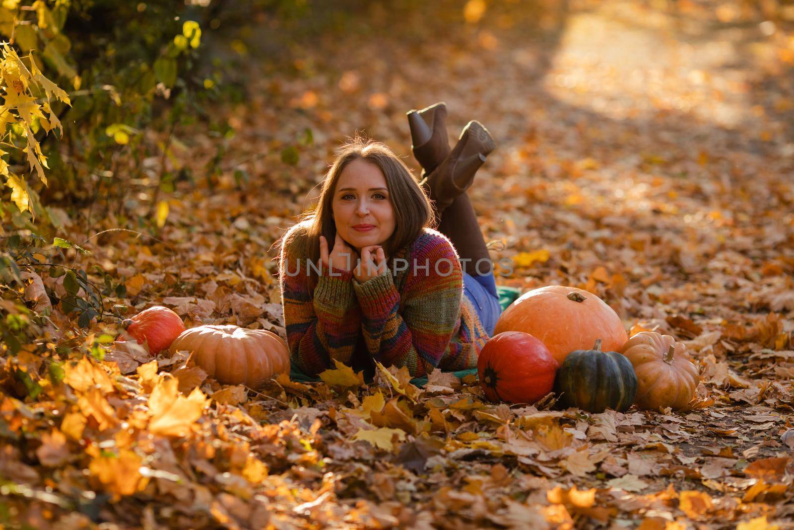 Portrait of happy smile woman with pumpkins in hand. by oksix