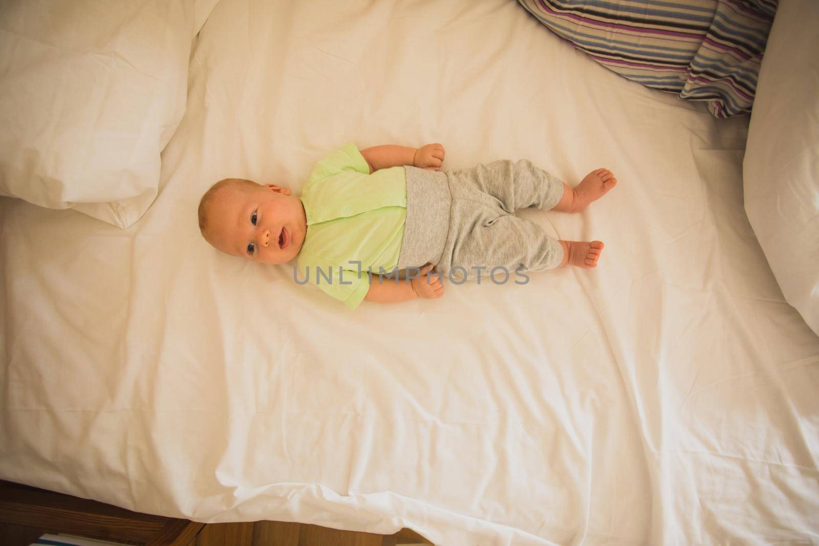 Mother and newborn baby sleep in the bed together