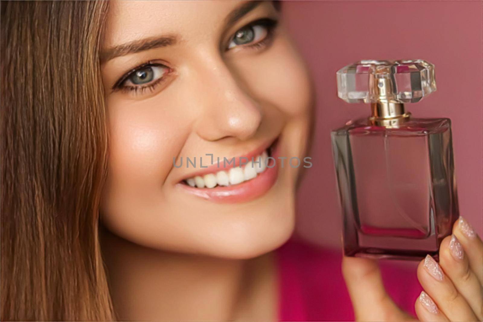 Perfume, beauty product and cosmetics model face portrait on pink background, beautiful woman holding fragrance bottle with floral feminine scent, fashion and makeup by Anneleven