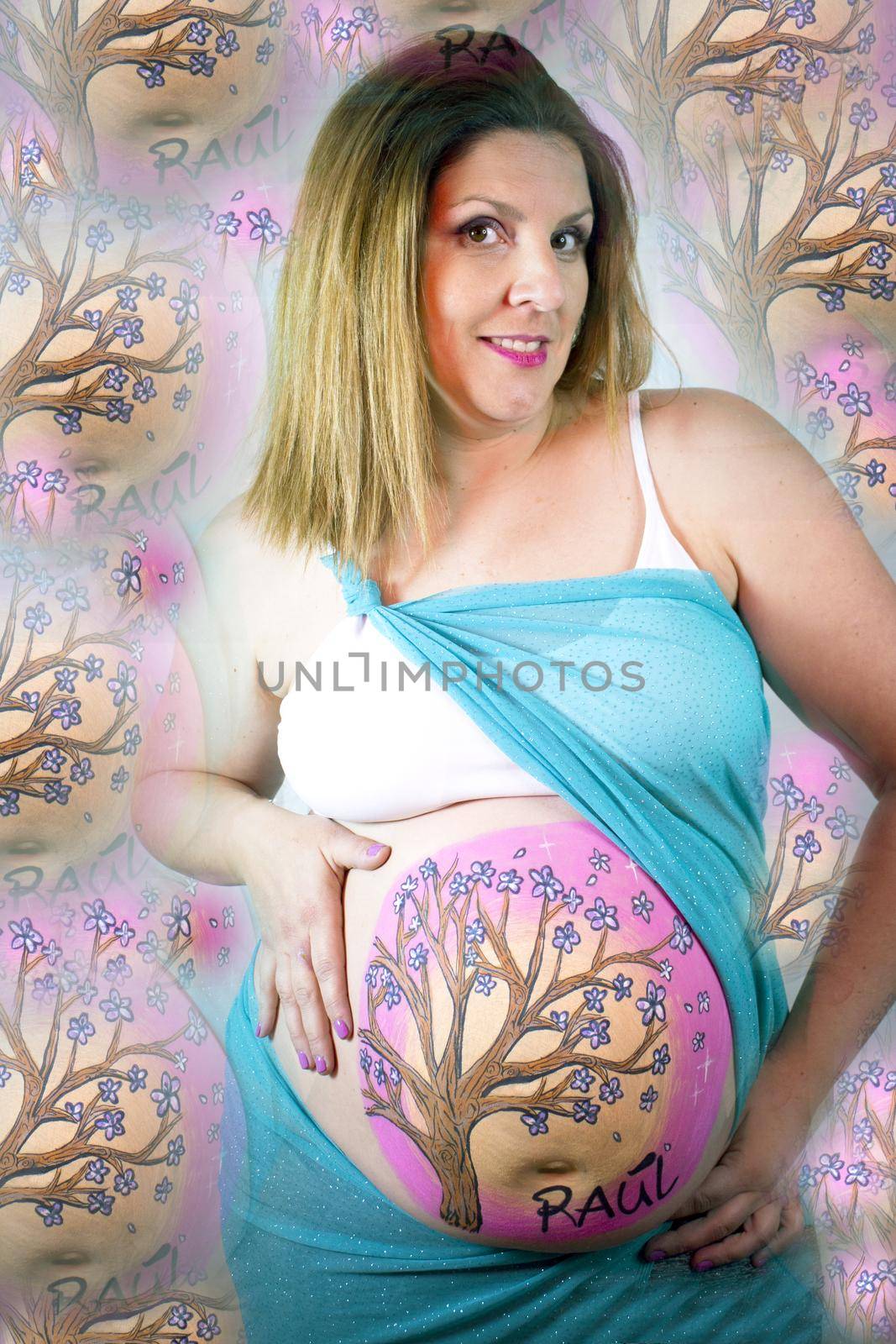 Eight months pregnant woman with bright dress and drawing on her belly by GemaIbarra