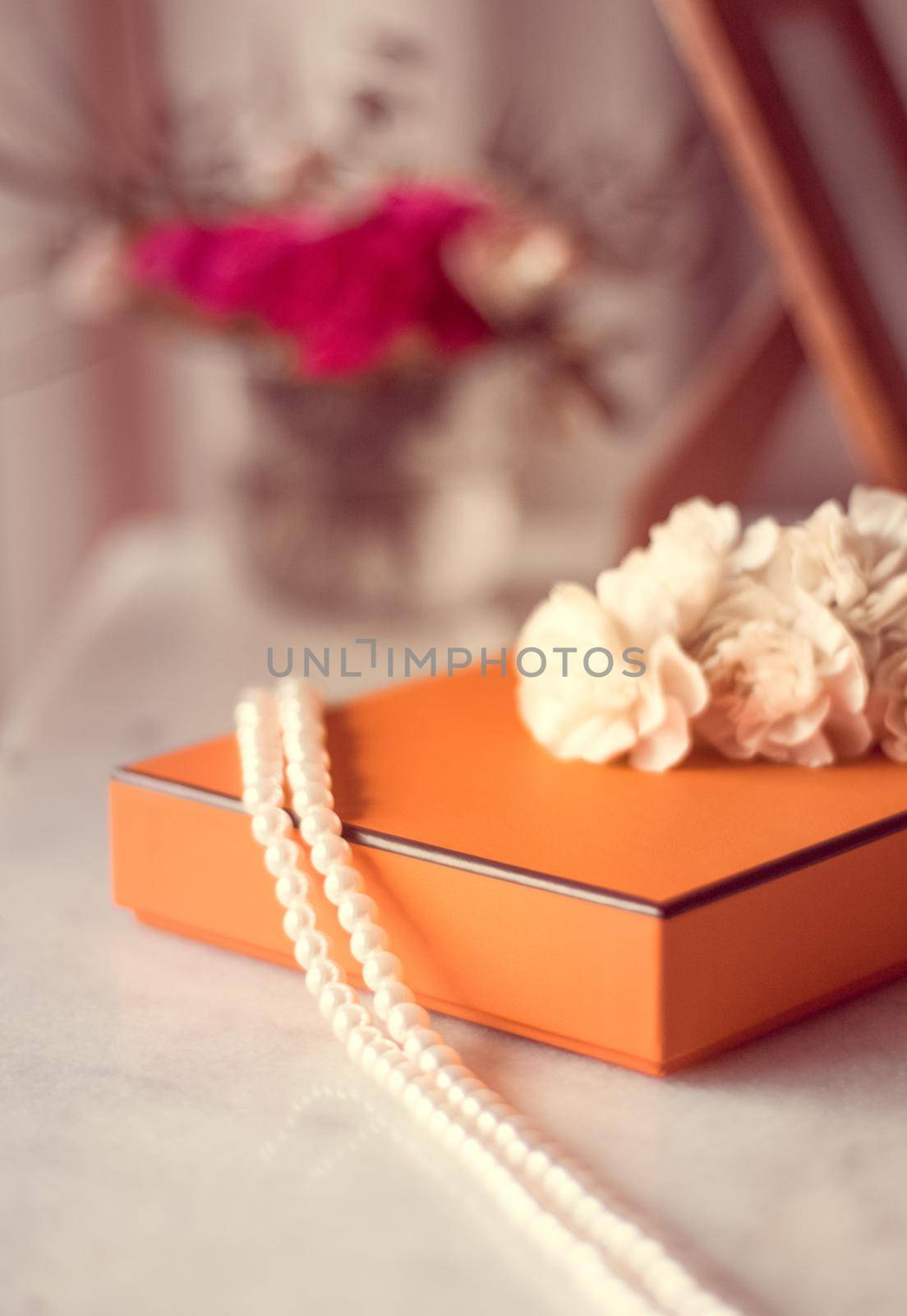 Present box and flowers for her - Mother's day ideas, happy giving and holiday inspiration concept. The perfect gift for mom