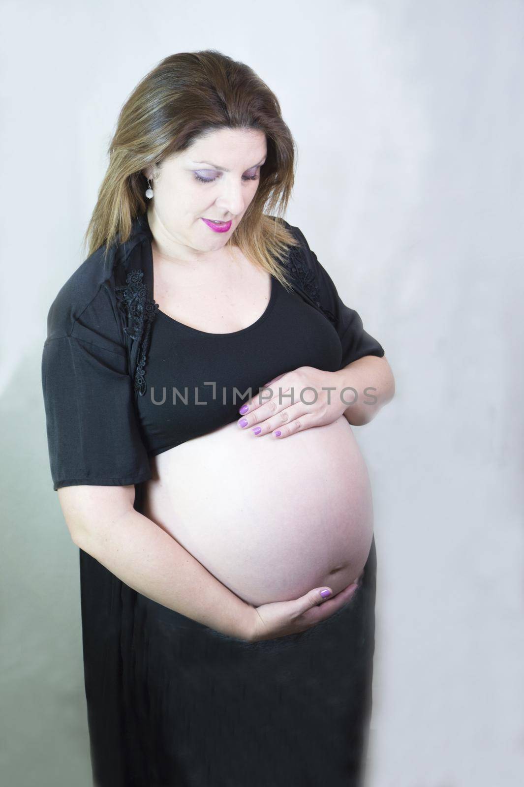 Eight month pregnant woman with bare belly by GemaIbarra