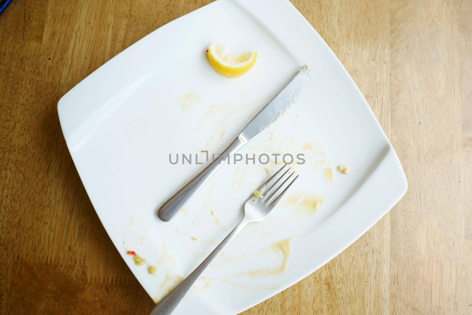 Empty plate after eating on table ,