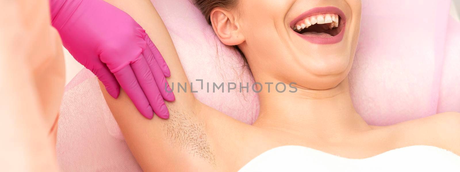 Young woman during armpit examination by okskukuruza