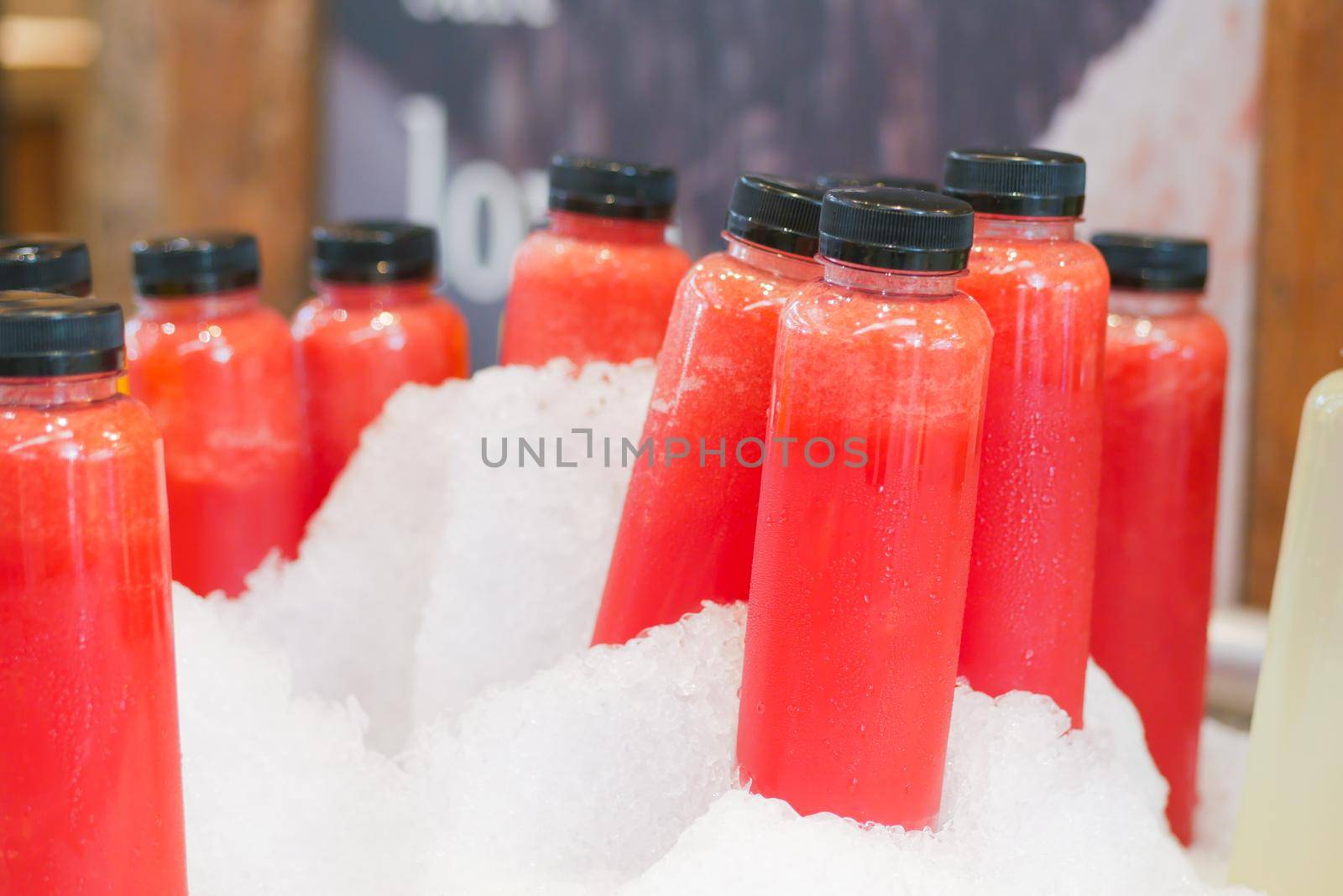 plastic bottles of soft drink into ice cube .