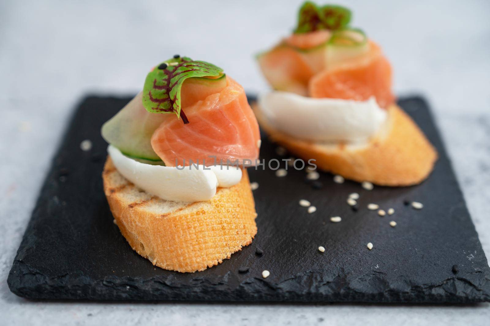 Sandwich with bread salmon slices and soft cheese