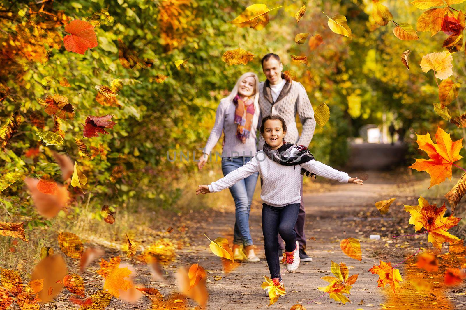 Family playing in autumn park having fun. High quality photo