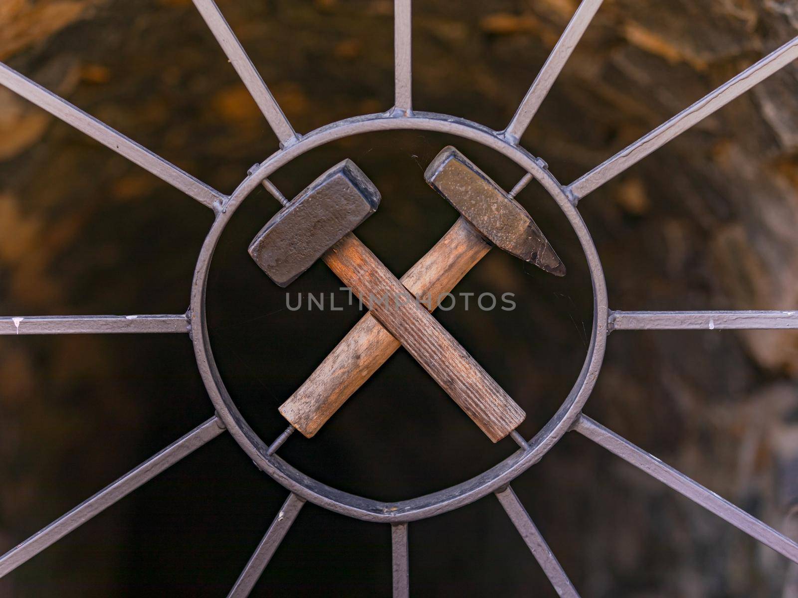 Crossed hammers on a door in front of an old mine in Germany