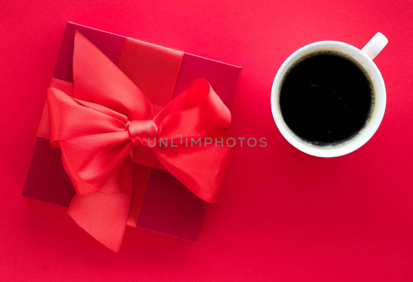 Romantic celebration, lifestyle and birthday present concept - Luxury beauty gift box and coffee on red, flatlay