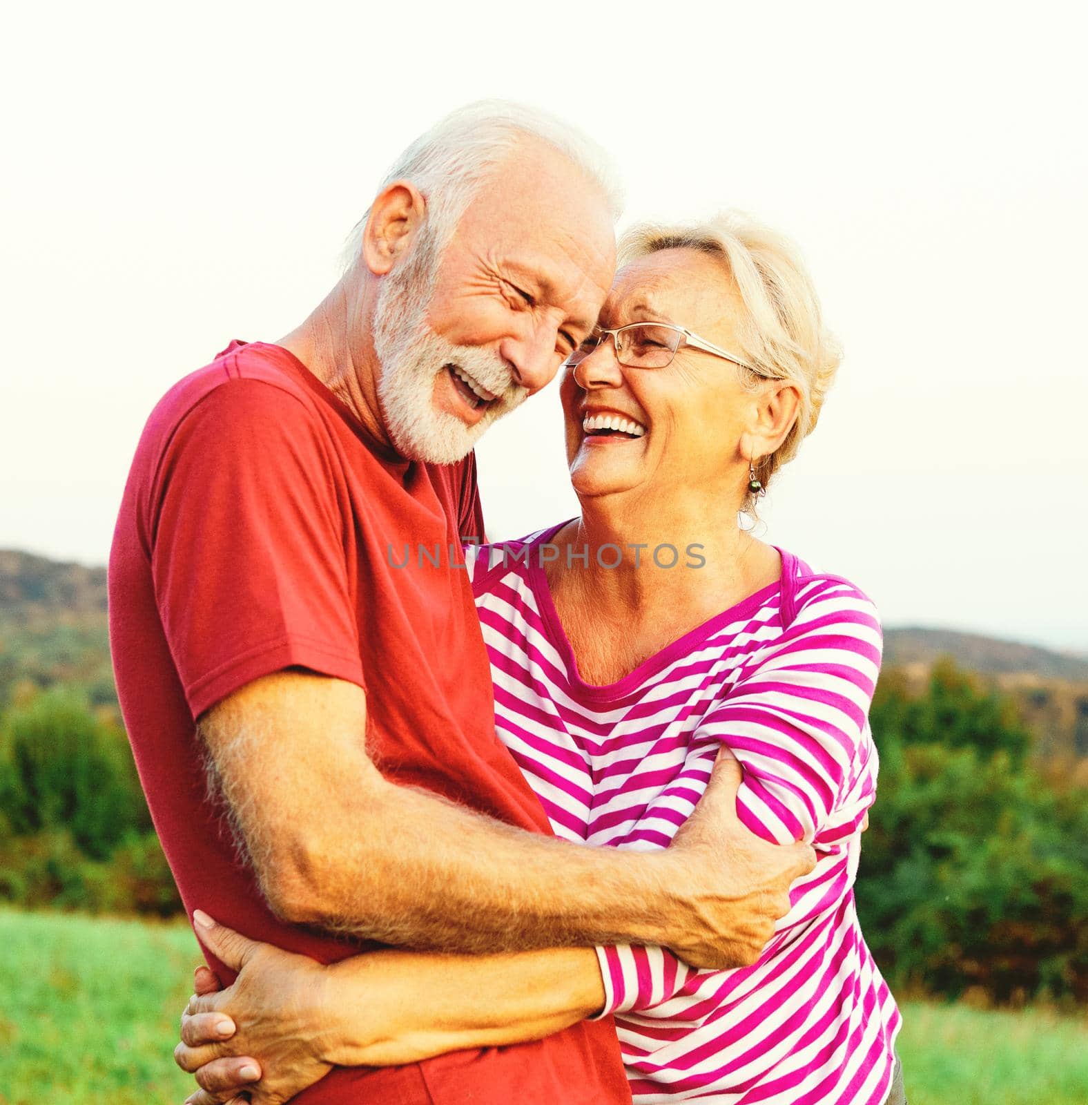 Happy active senior couple outdoors