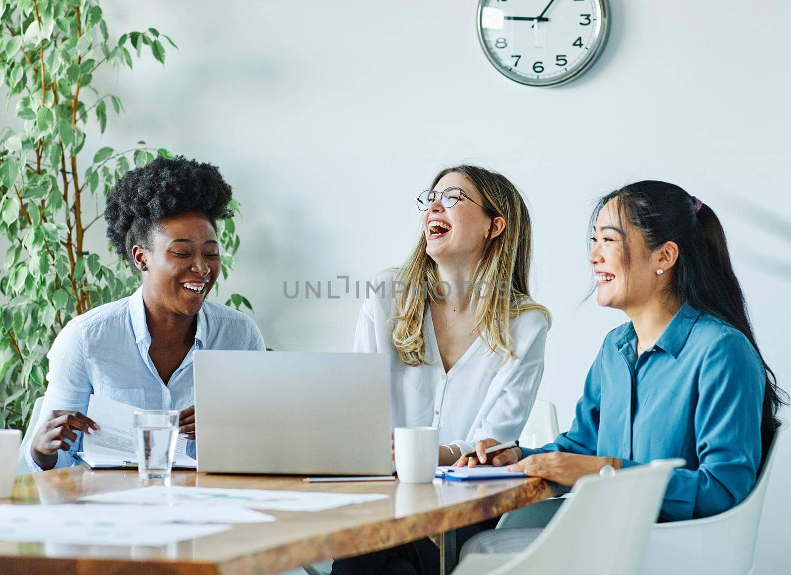 Portrait of a group of youn happy people in a start up office