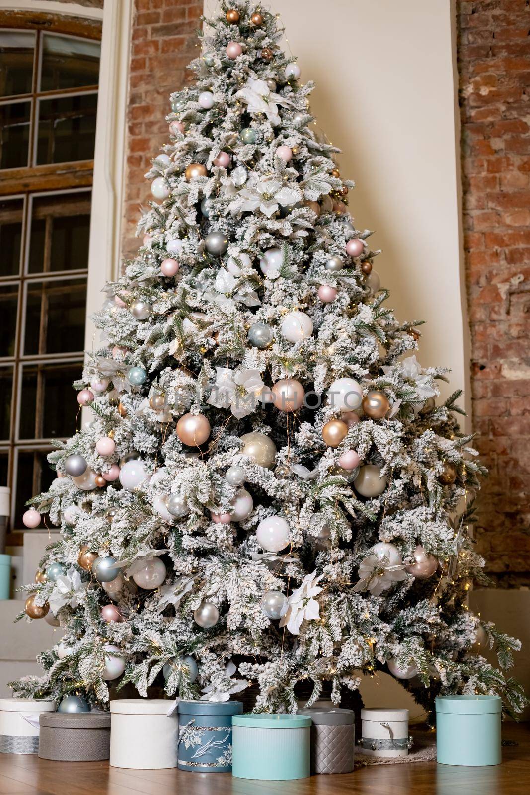 Delicate Christmas tree presents in a bright room