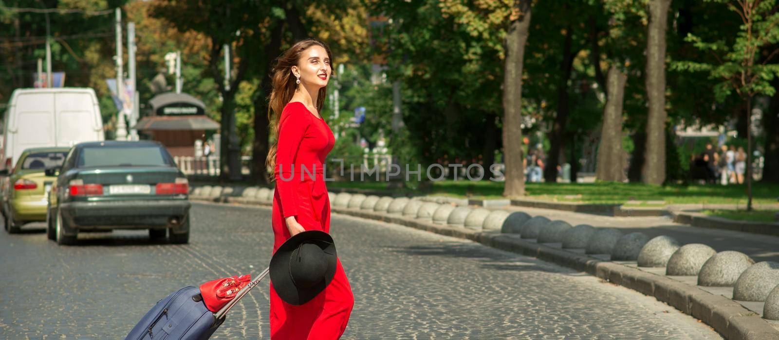 Woman crosses road through crosswalk by okskukuruza