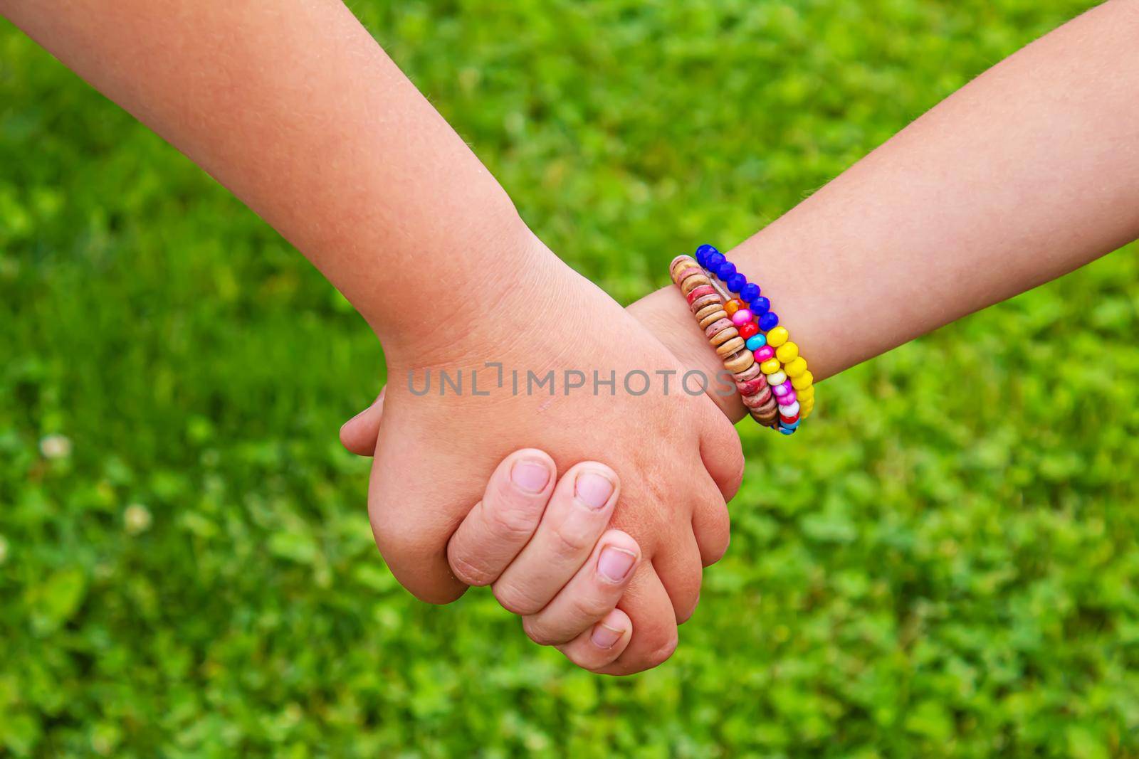 The children put their hands together. Selective focus. kids