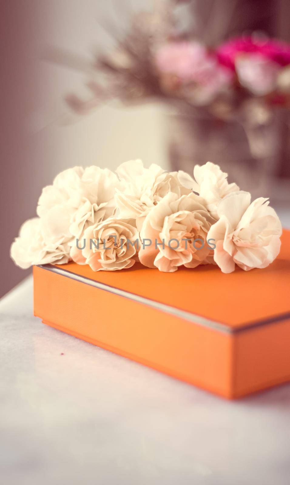 Present box and flowers for her - Mother's day ideas, happy giving and holiday inspiration concept. The perfect gift for mom