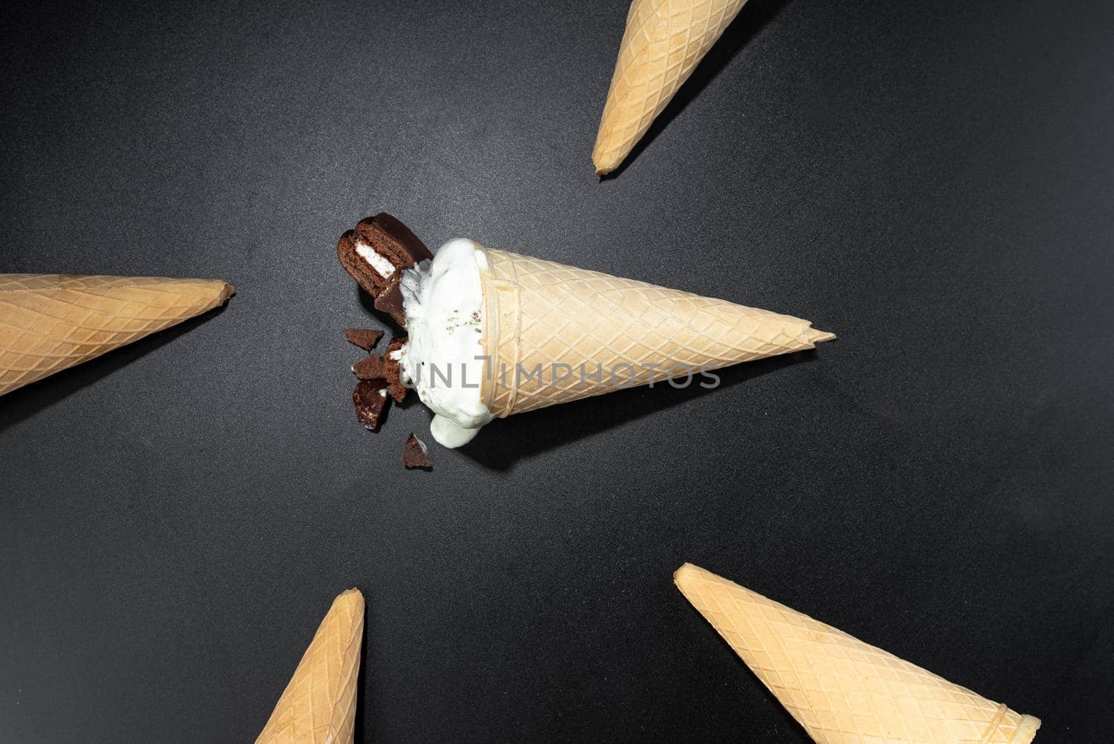 Homemade Cookies and cream cone ice cream, dark background photo with flash. Flashy food Ice cream.