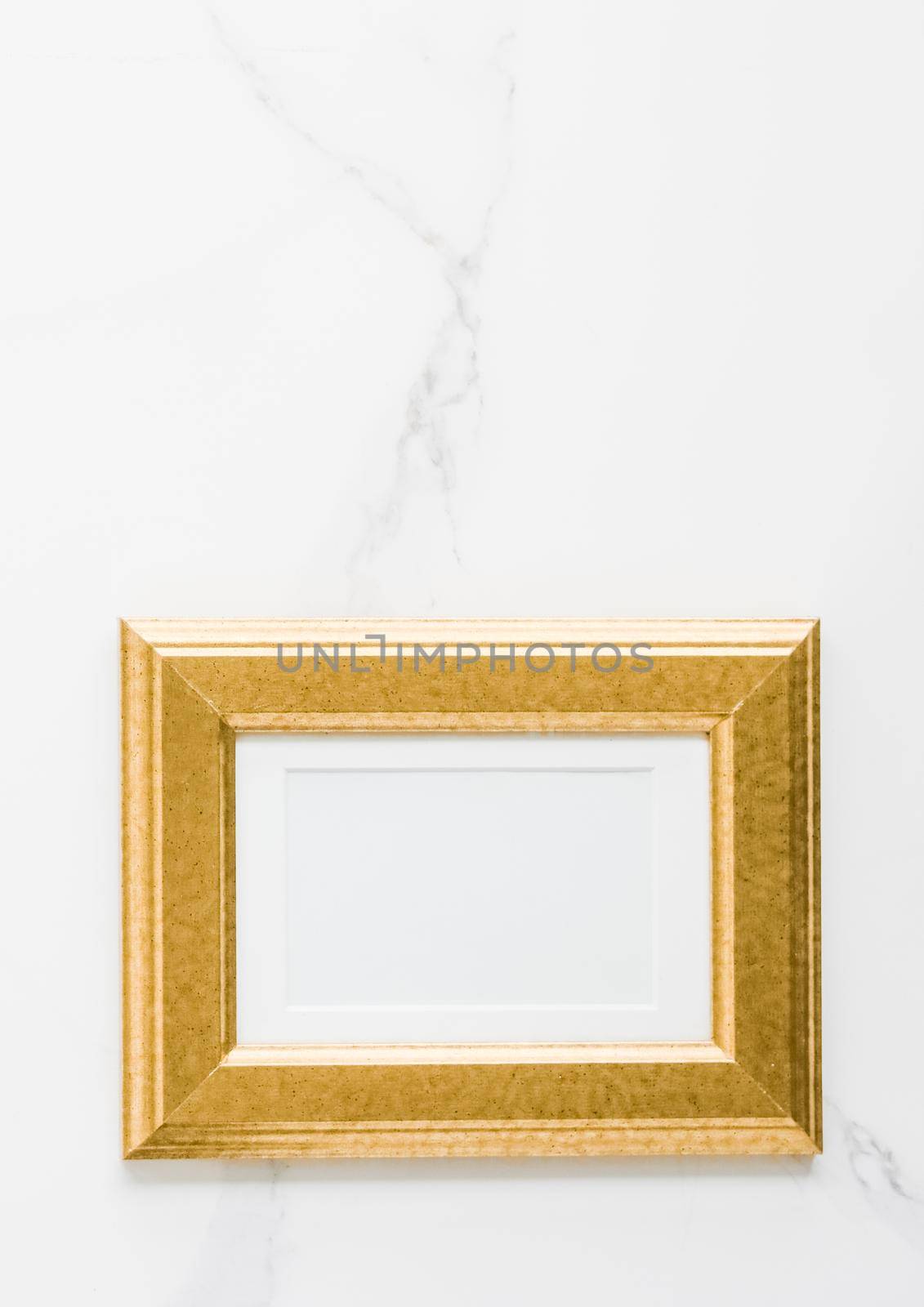 Golden photo frame on marble, flatlay - modern feminine, artwork mock up, luxury design concept. Decorate with chic and style