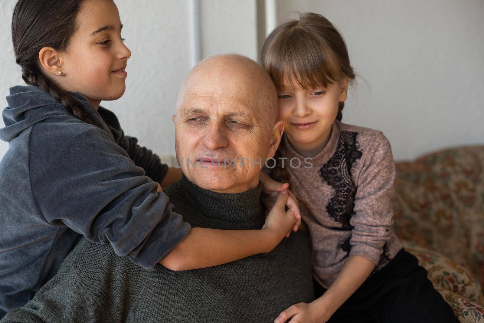 Family bonding. grandfather and child holding hands together, closeup view. Panorama.