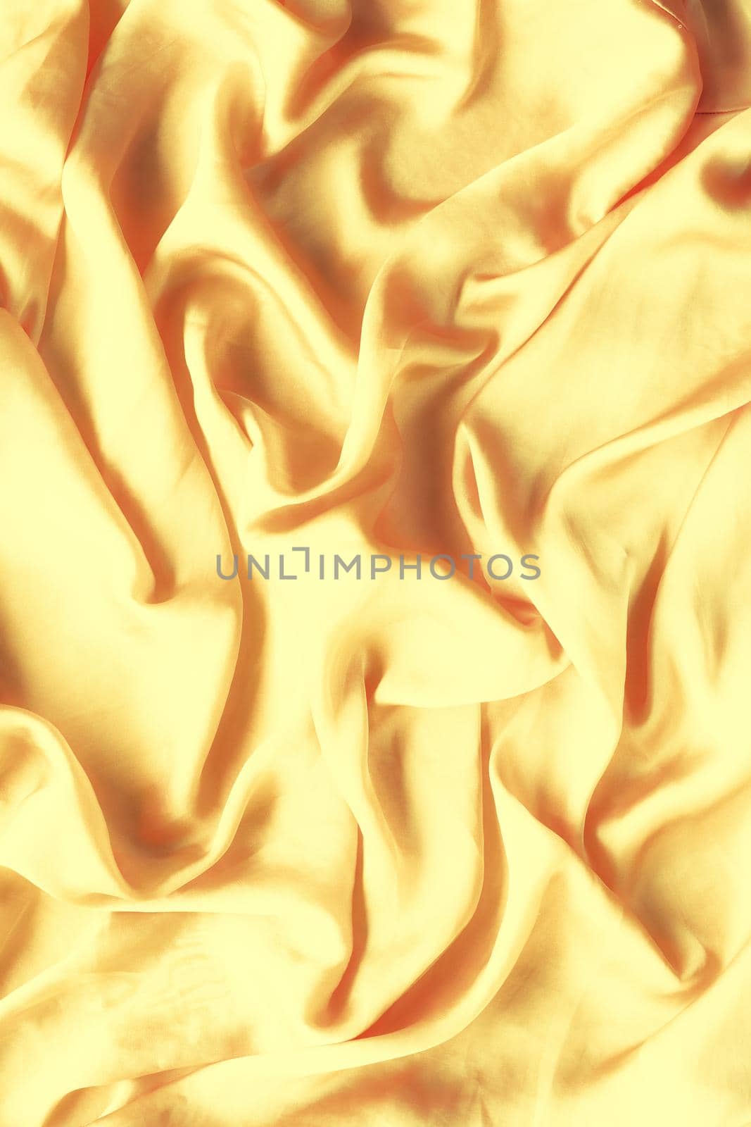 Luxury golden silk background texture - elegant fabric textures, abstract backgrounds and modern pastel colours concept