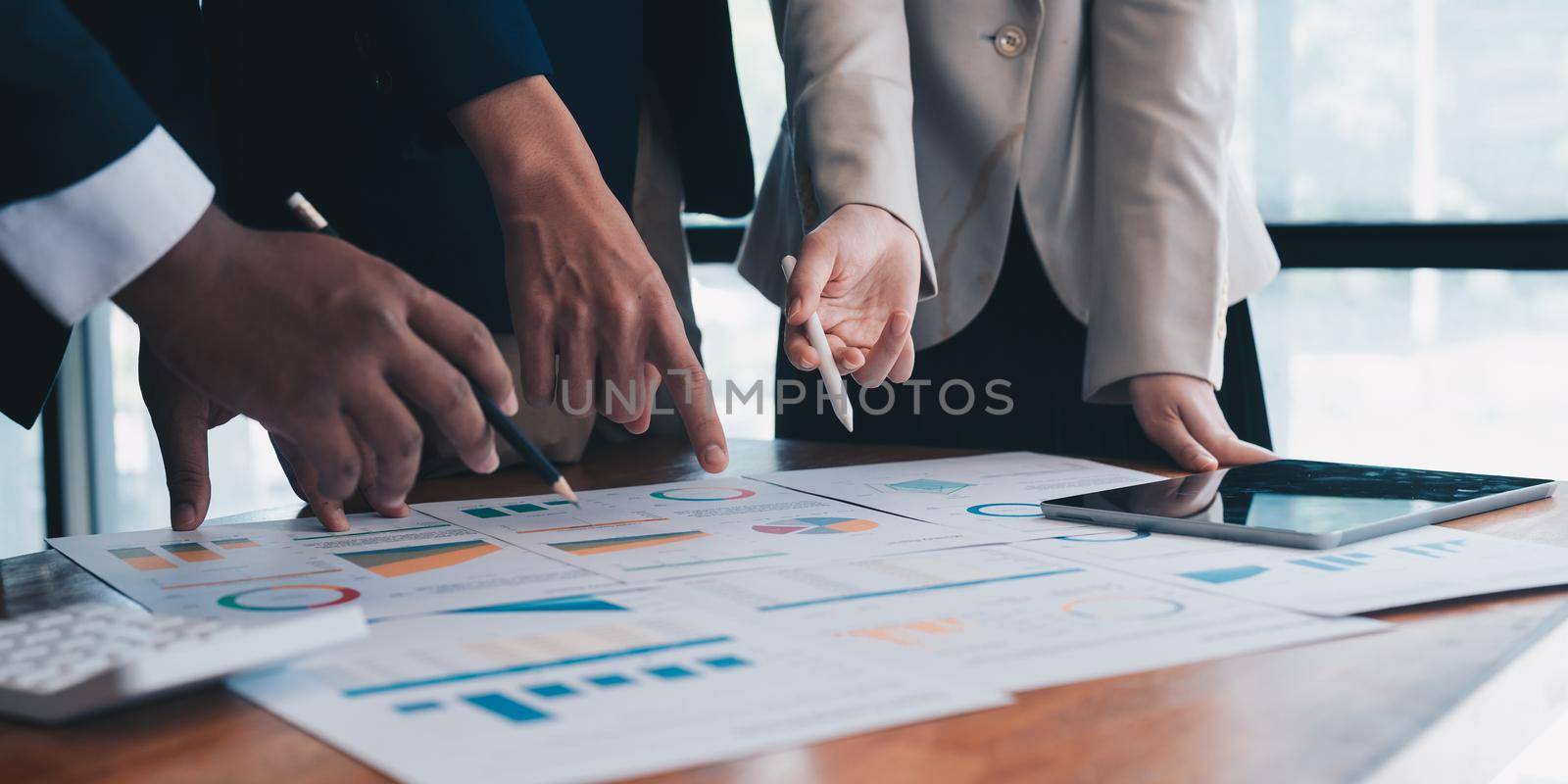 business adviser meeting to analyze and discuss the situation on the financial report in the meeting room.Investment Consultant, Financial advisor and accounting concept.