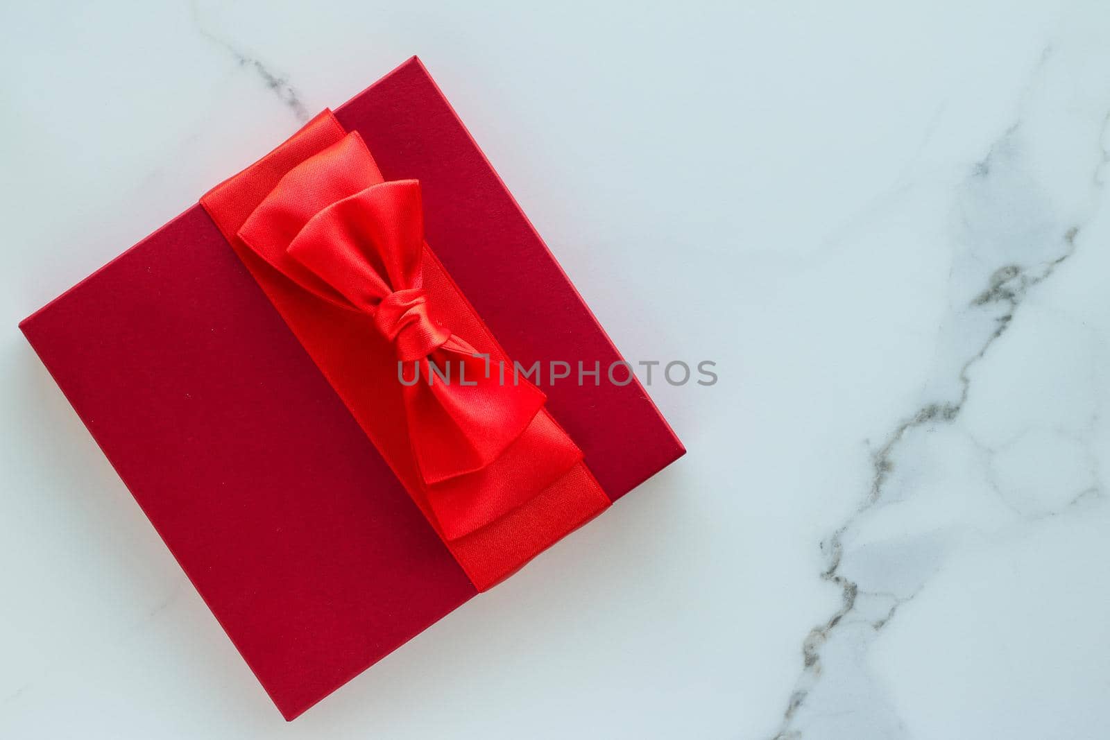 Luxury red holiday gifts on marble by Anneleven