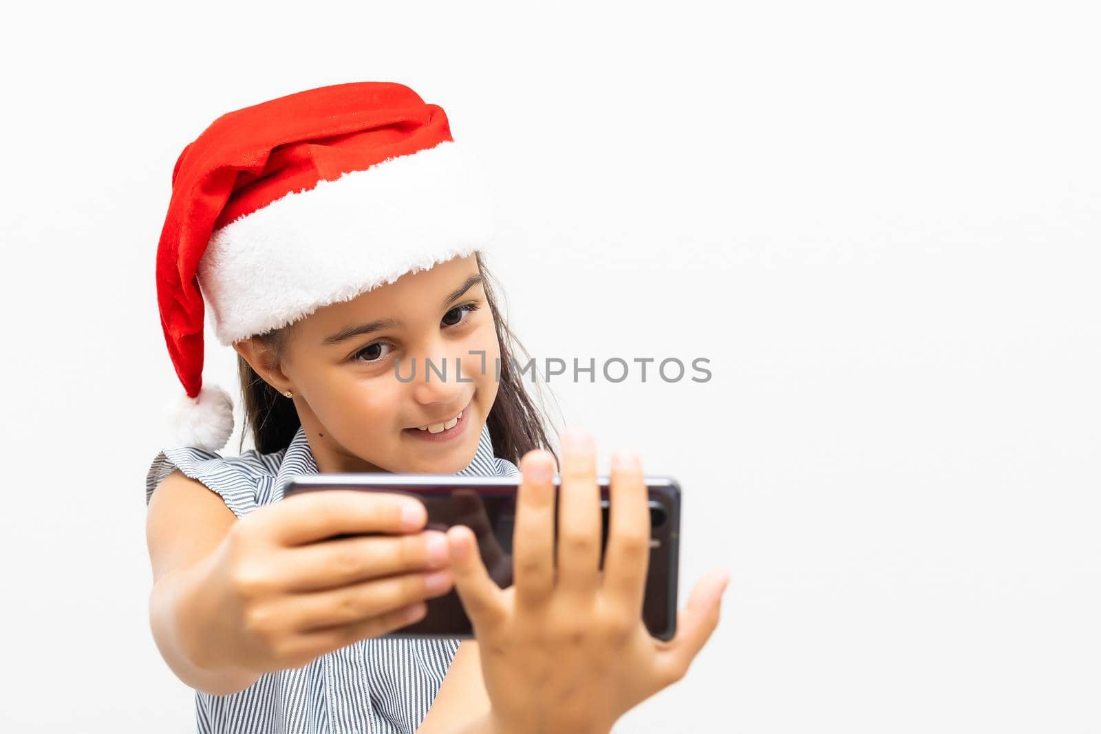 little girl on christmas isolated in white.