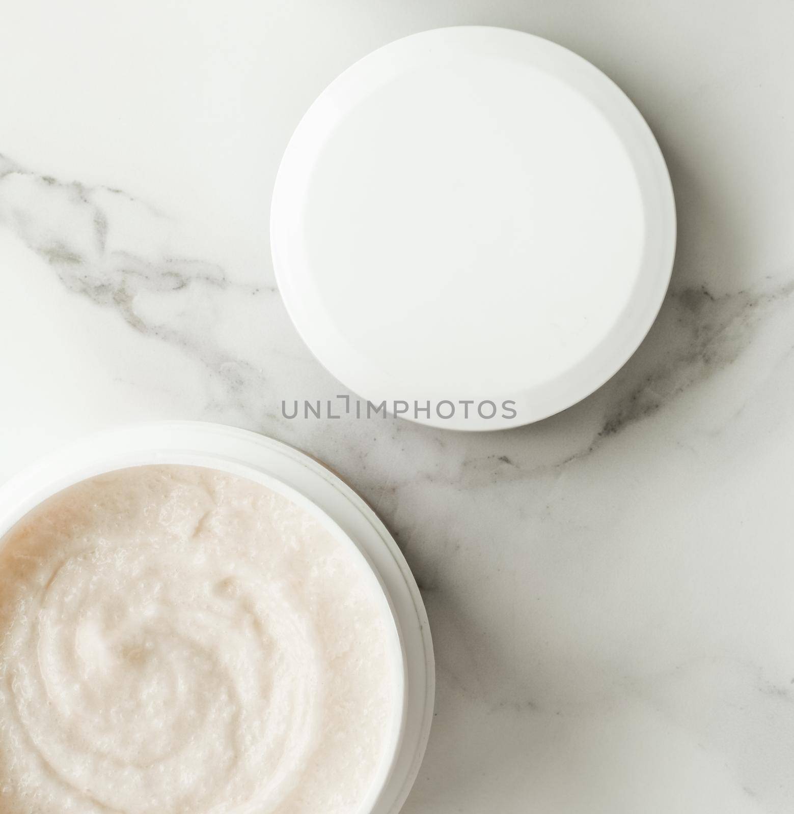 Scrub and exfoliating cream products on a marble, flatlay - skincare and body care, luxury spa and clean cosmetic concept. Health and beauty of your skin