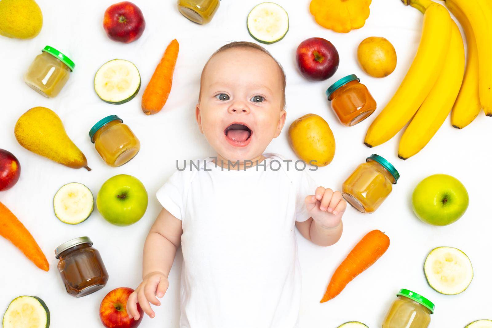 Puree for baby food with vegetables and fruits. Selective focus. nutrition. The first complementary feeding of the child. A happy child. A well- fed child