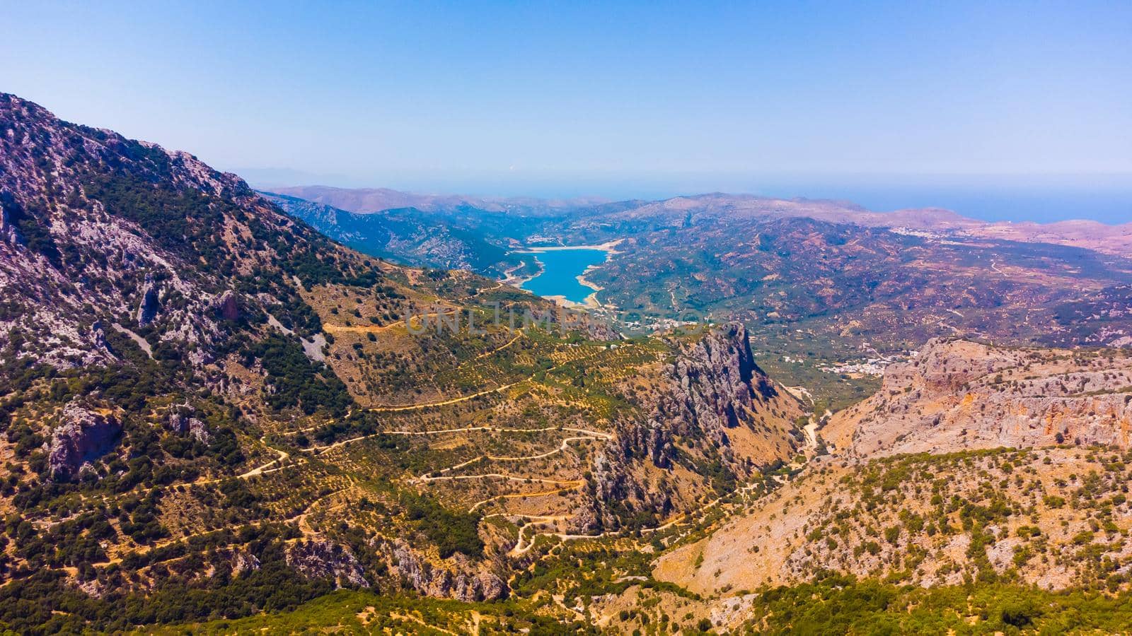 Landscape of high hills in Crete on the background of the sky.