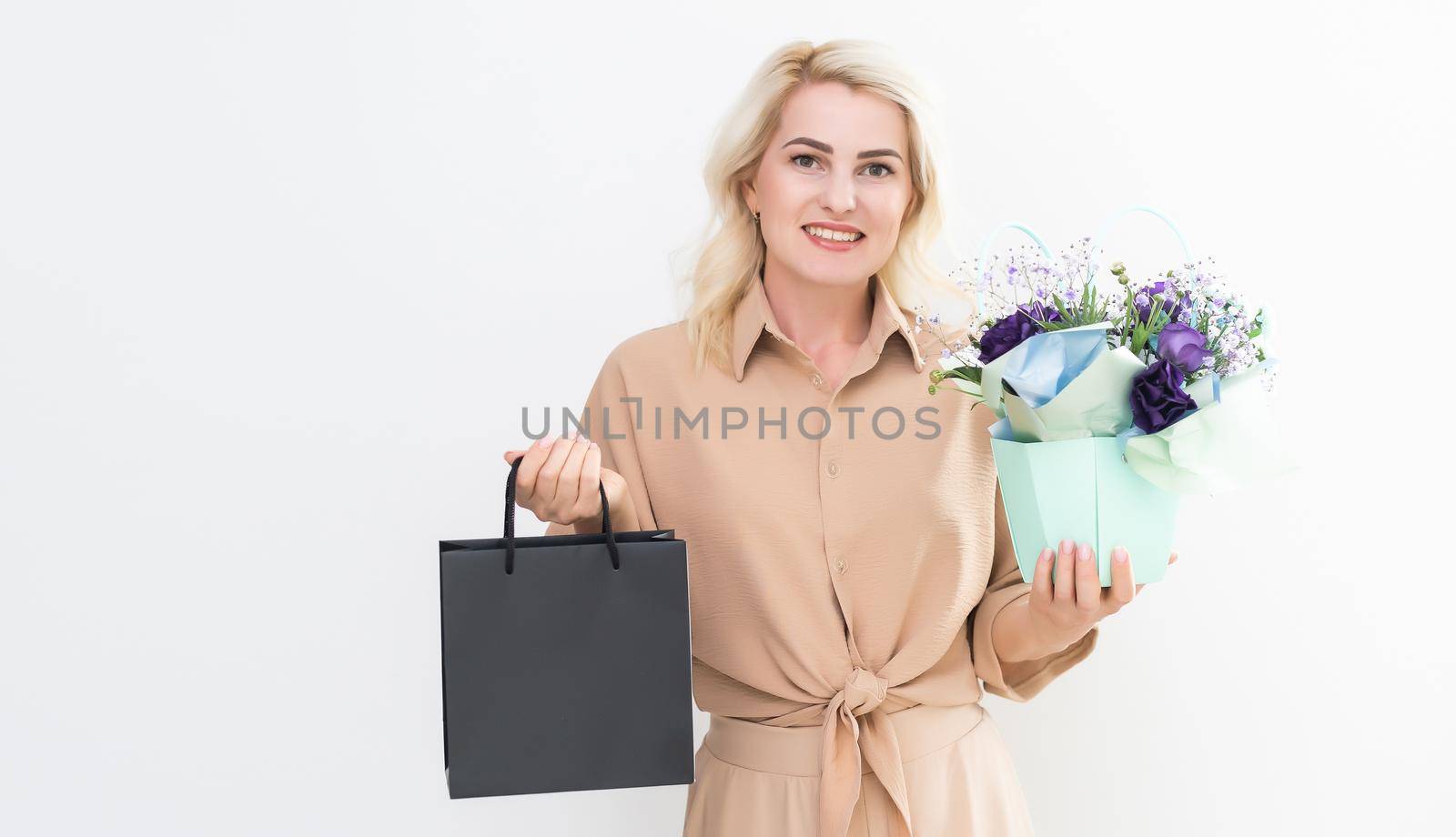 Excited young woman girl in summer clothes isolated on white background. Shopping discount sale concept. Mock up copy space. by Andelov13