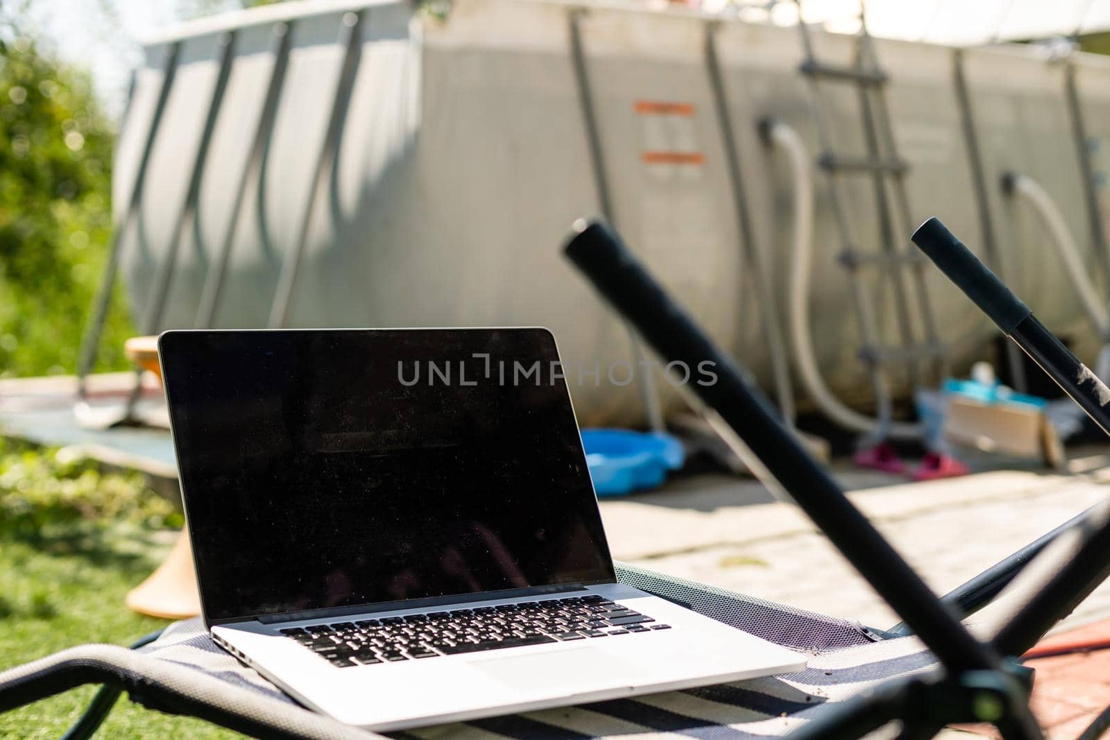 Laptop on the garden, close-up. by Andelov13